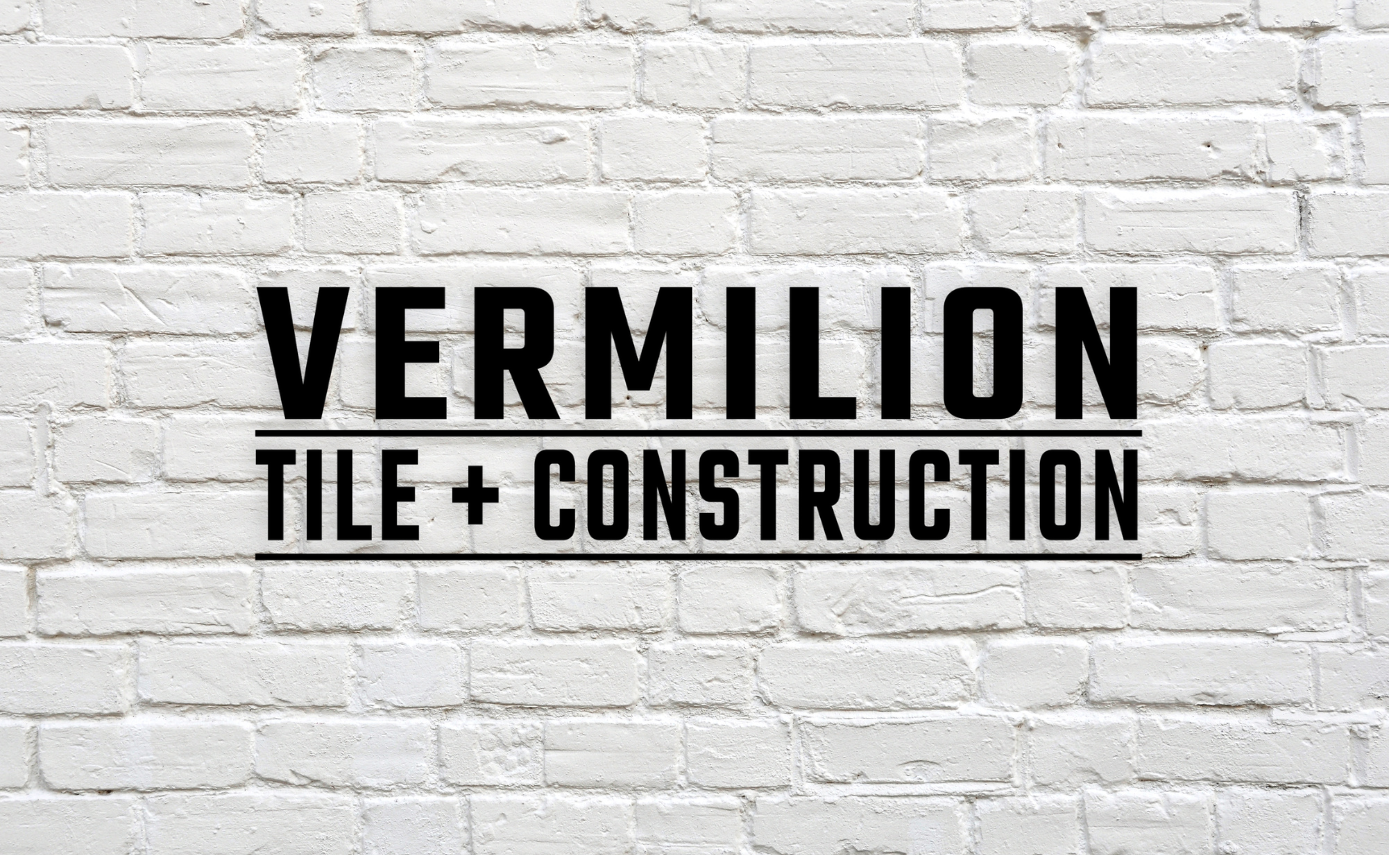 Logo on white brick wall